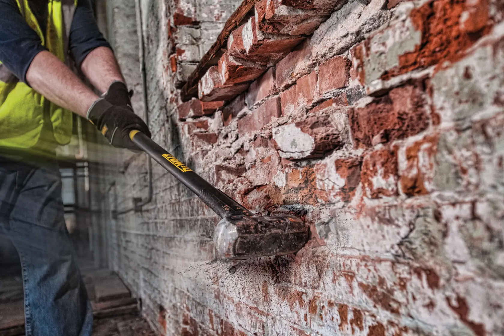 10 pound EXOCORE Sledge Hammer striking brick wall.